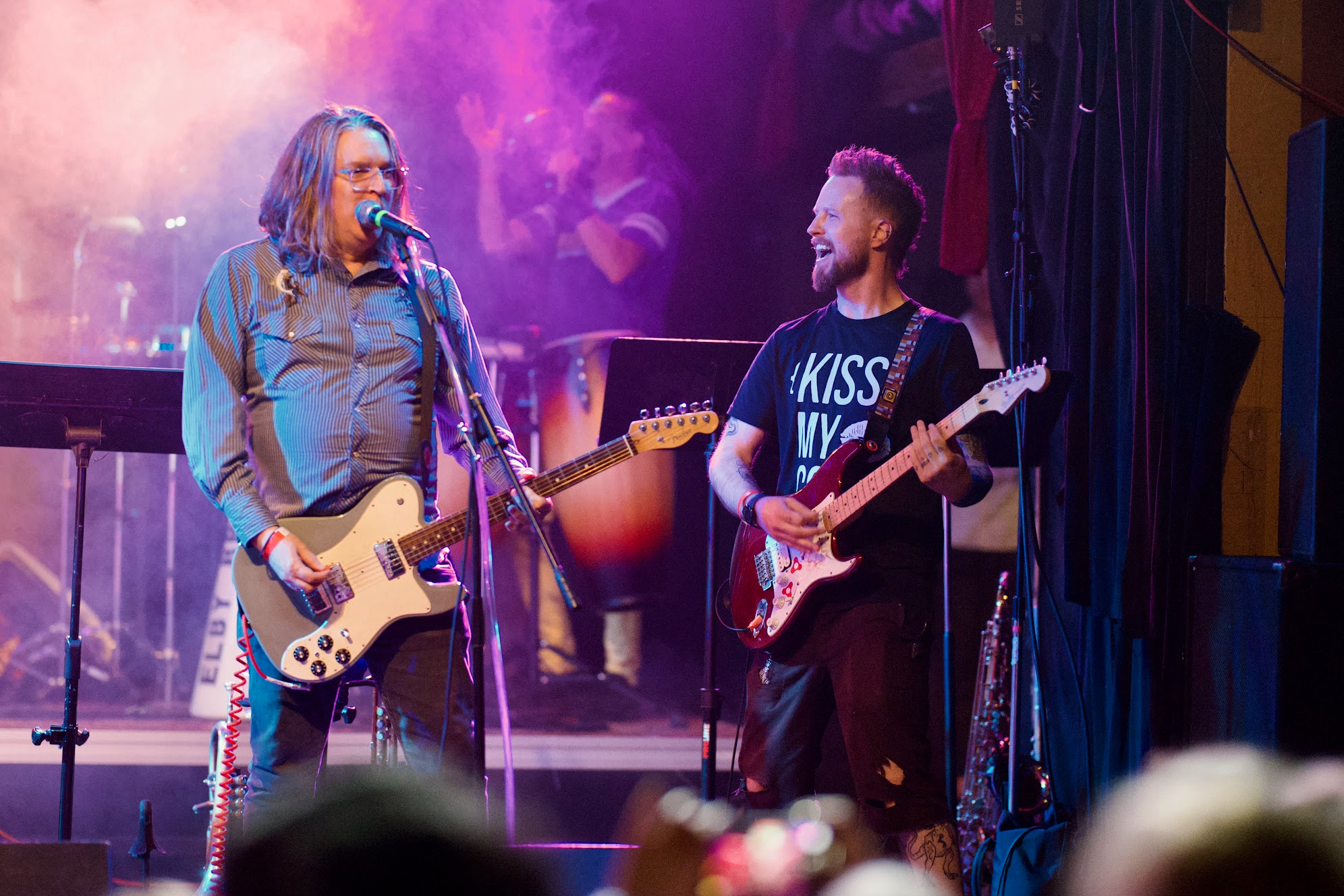 Me with a 'KISS MY CSS' shirt on, weilding an electric guitar on a stage