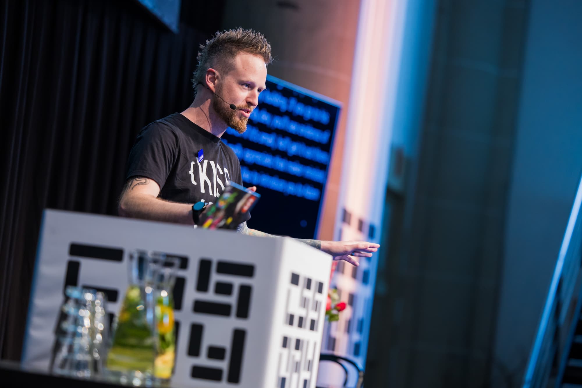 Photo of me on stage gesturing to the crowd