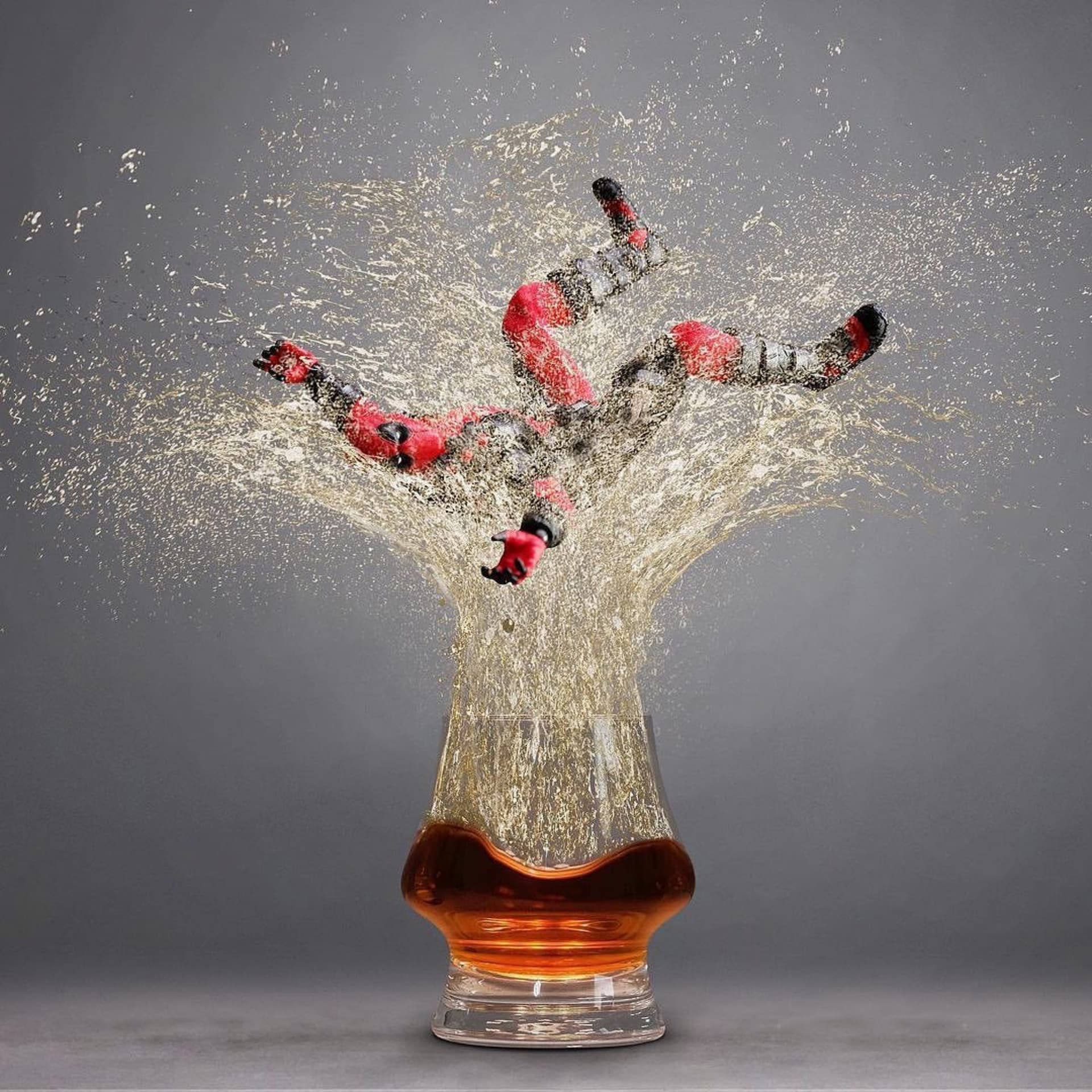 The Denver and Liely bourbon glass with Dead Pool falling into it